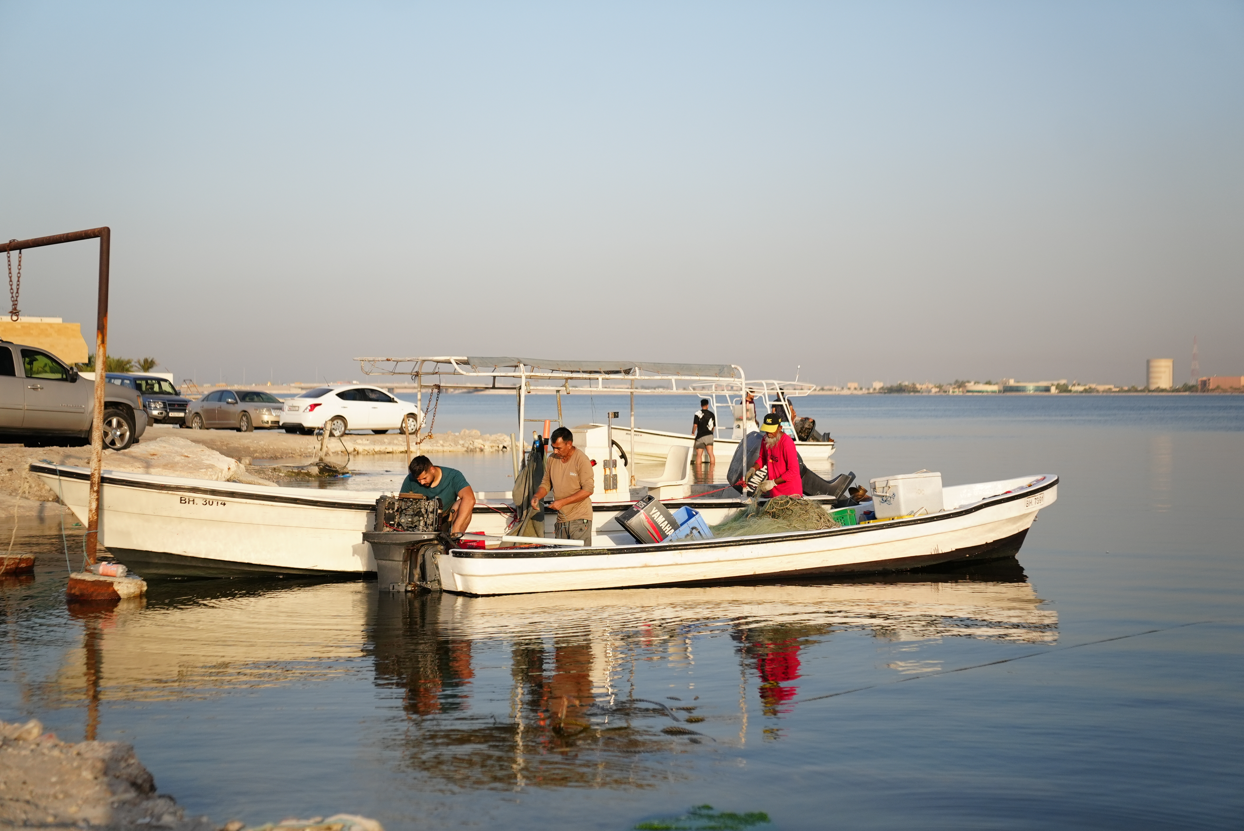Fishermen on Bahrain’s Arabian Gulf coast returning from a morning fishing trip.