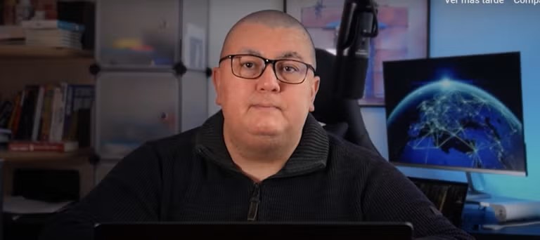 Luis Assardo sitting at a computer