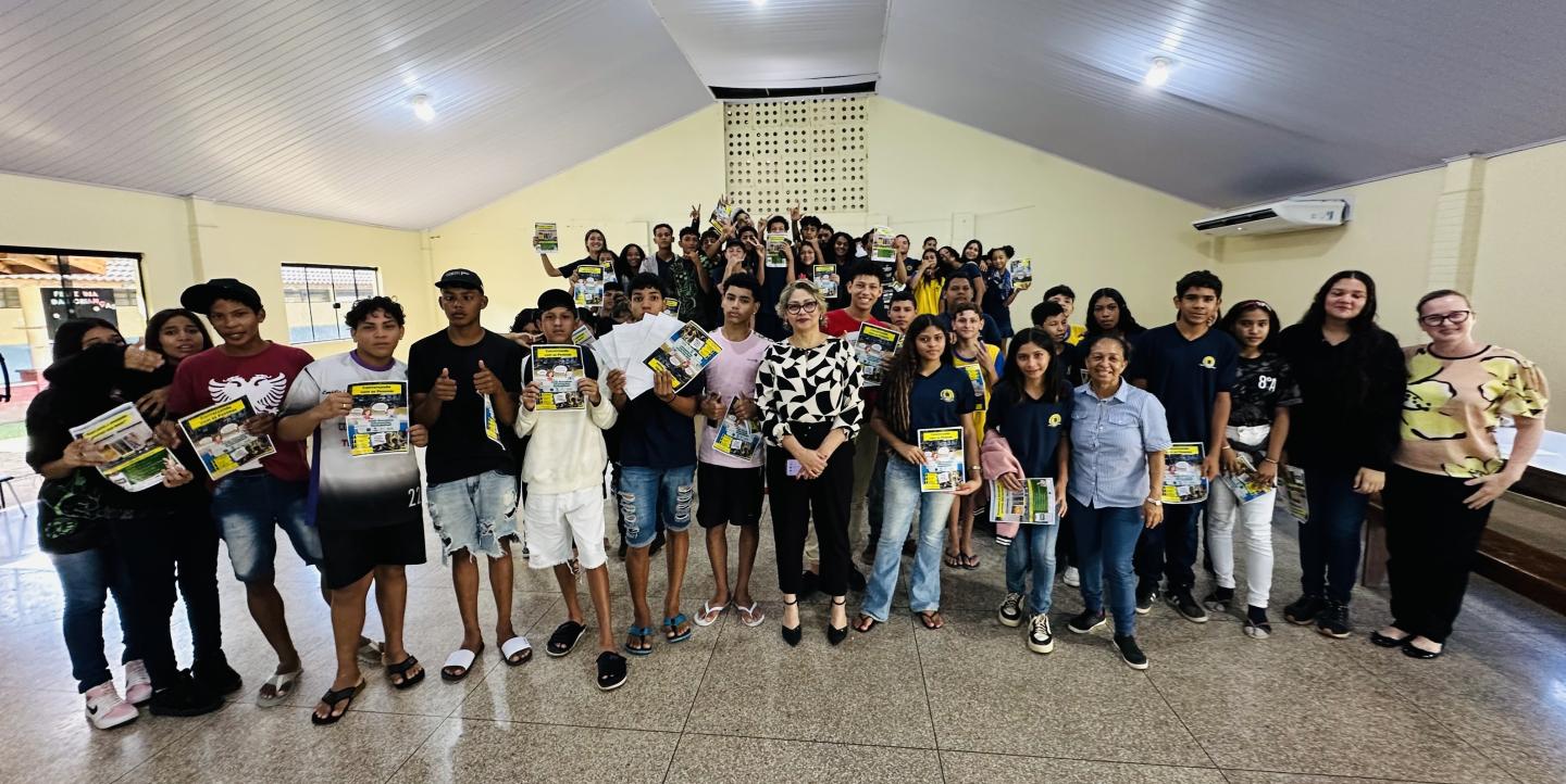 Josi posing with students. 