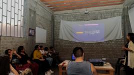 Ascarza teaching church community members.