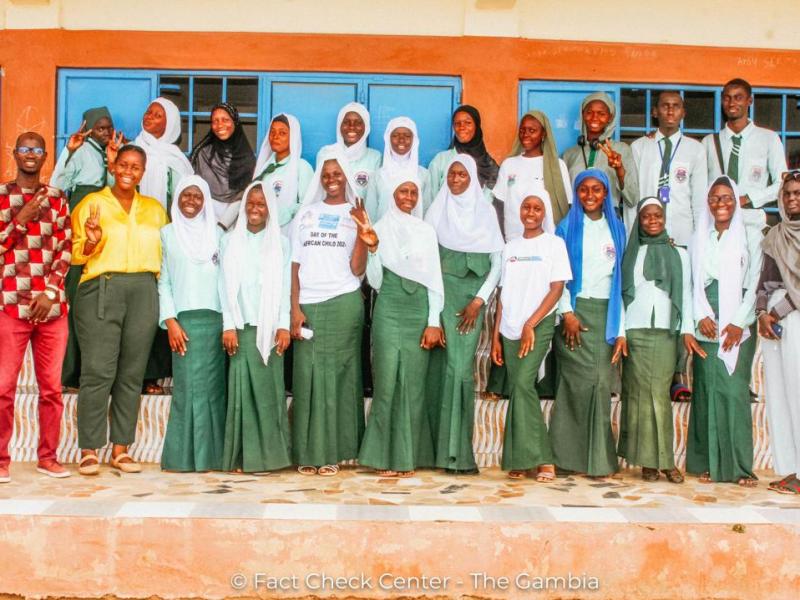 A group of women in front of a school in the Gambia