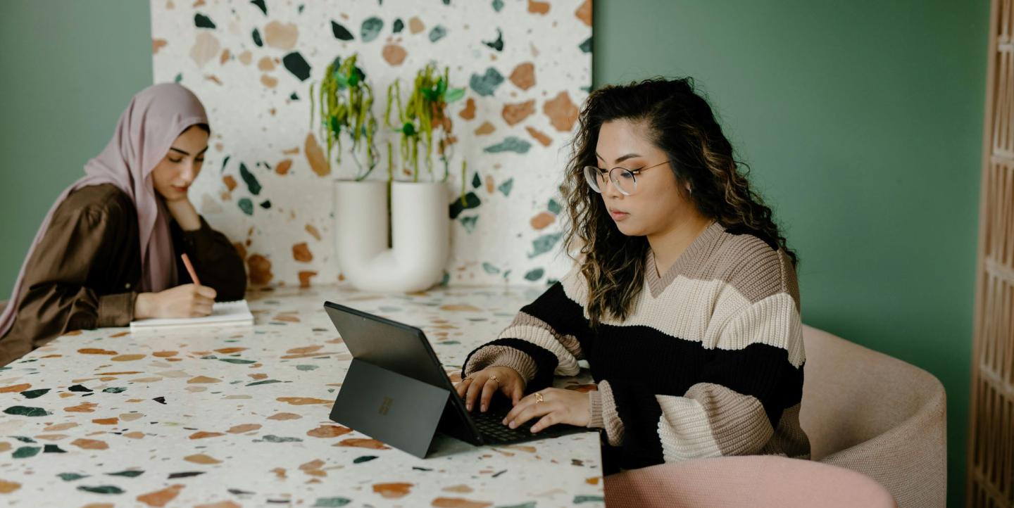 Two women working