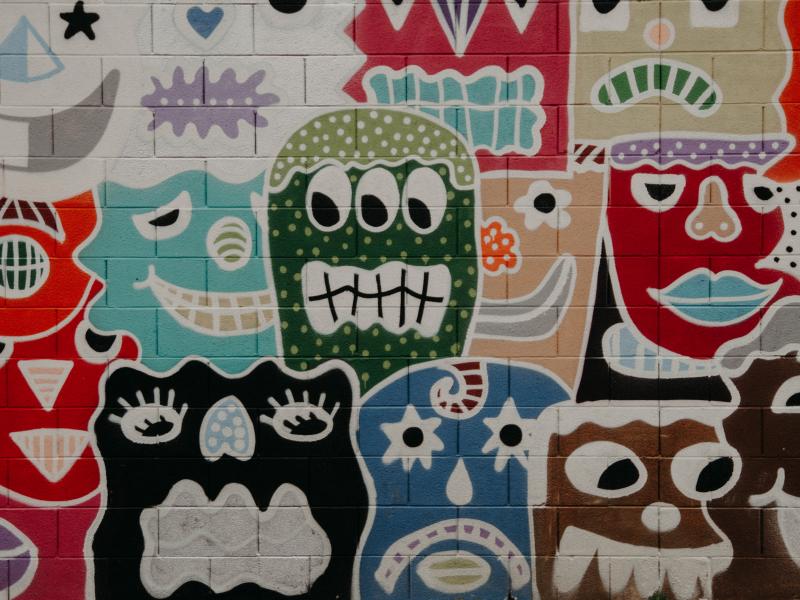 Painted cartoon faces showing different emotions