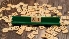 Scrabble pieces that spell AI.