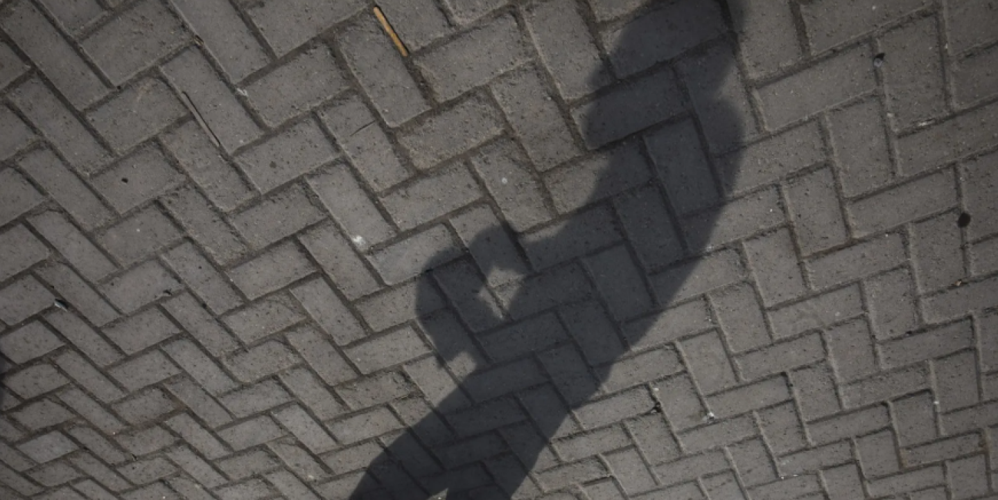 A man's shadow captured on the ground