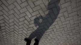 A man's shadow captured on the ground